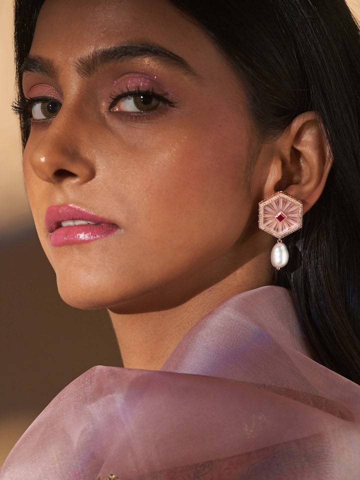 Styled view of Lapidary 14 Karat Gold Drop Earrings worn on the ear, showing how it looks styled