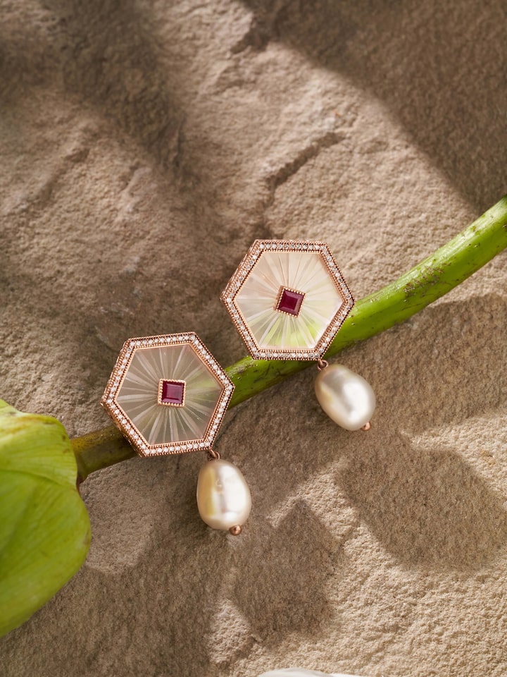 Styled view of Lapidary 14 Karat Gold Drop Earrings worn on the ear, showing how it looks styled, from a different angle
