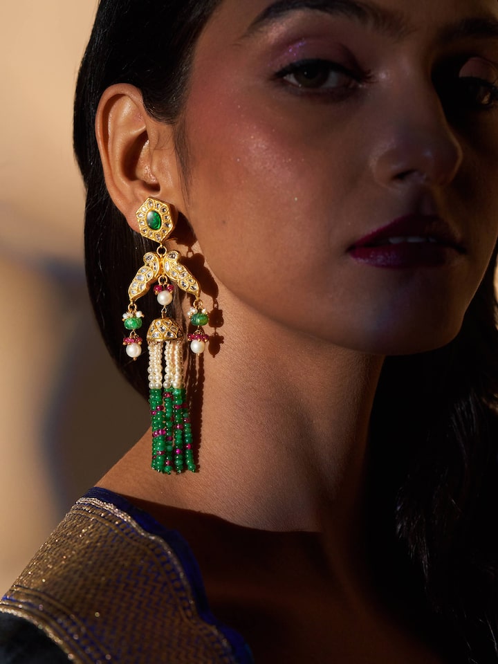Lifestyle image of Thappa 22 Karat gold earrings worn with ethnic wear for festive flair.