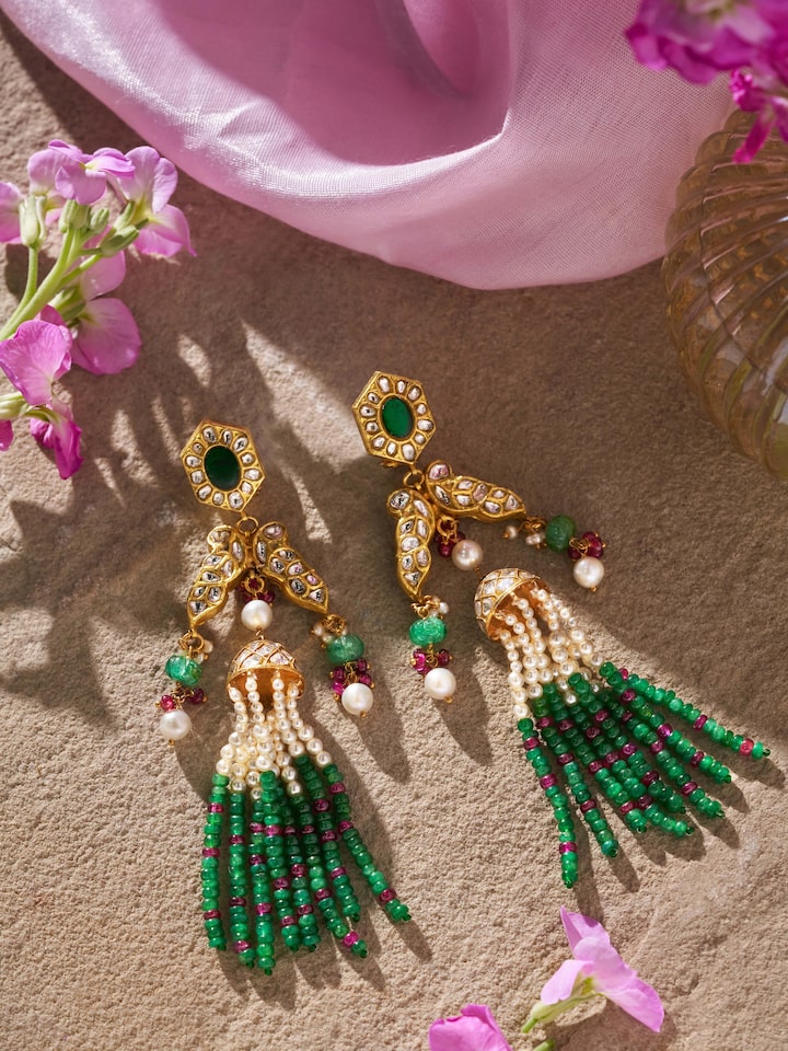 Lifestyle shot of Thappa 22 Karat gold drop earrings styled for an elegant Indian look.