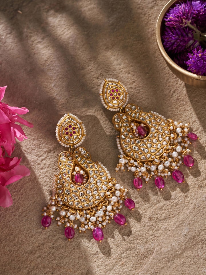 Side view of 22 karat gold drop earrings showcasing their elegant design and craftsmanship