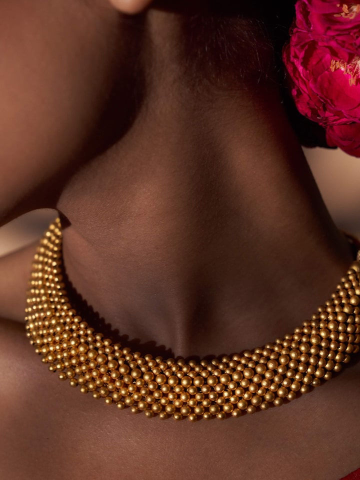 Alternate detail shot highlighting pendant section and lustrous 22 Karat finish
