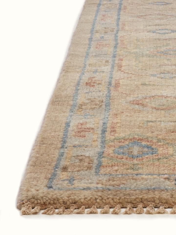 Detailed view of Oushak traditional beige Bhadohi wool hand-knotted rug focusing on the rug's hand-knotted craftsmanship and pattern