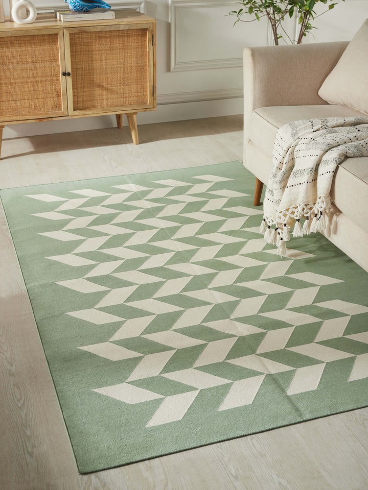 Detailed view of Modern geo chevron light green ivory lawan cotton panja dhurrie kharad highlighting the cotton texture and chevron design.