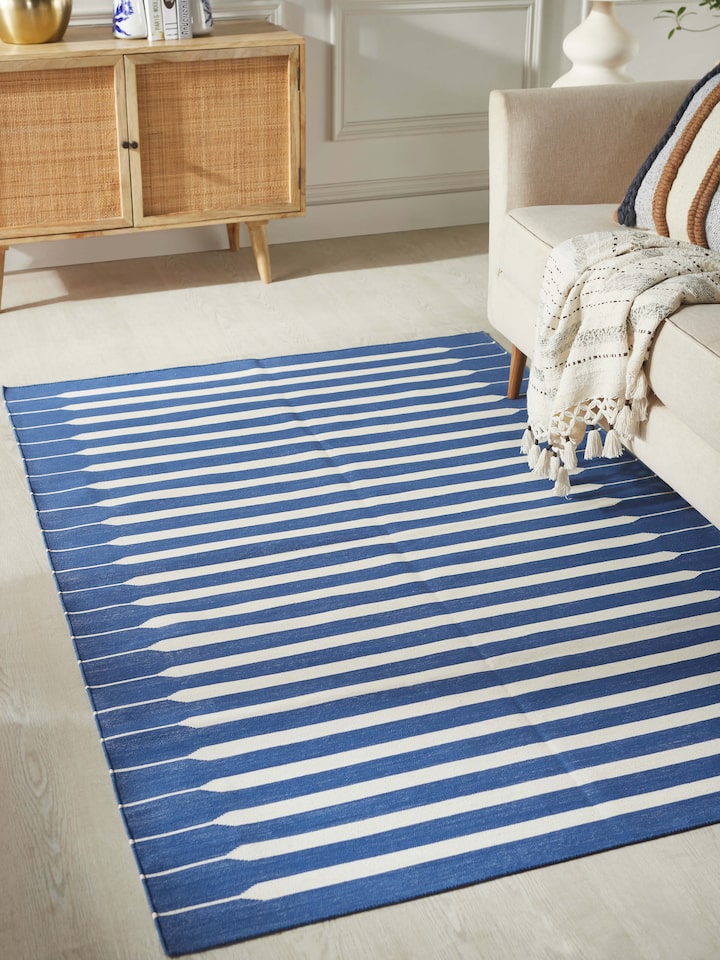 Close-up of Modern geo stripe blue lawan cotton panja dhurrie highlighting the detailed stripe pattern and texture.