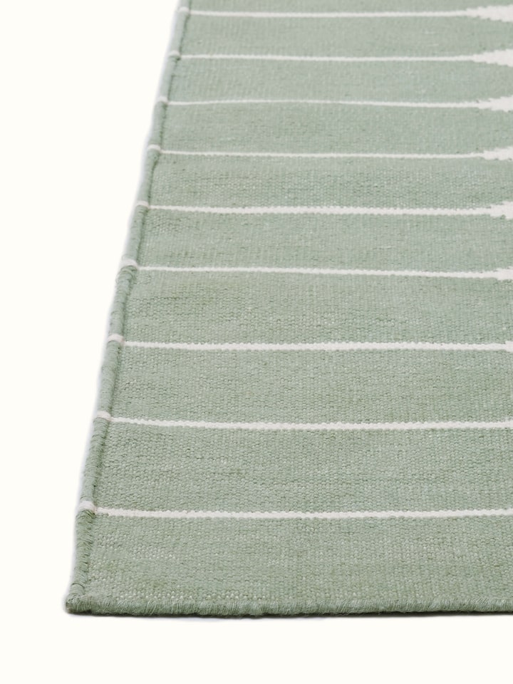 Full view of Modern geo stripe light green ivory lawan cotton panja dhurrie kharad displaying the complete geometric stripe pattern and color scheme.