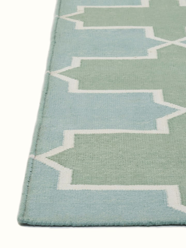Top view of Modern Geo Green Lawan Cotton Panja Dhurrie featuring green geometric motifs