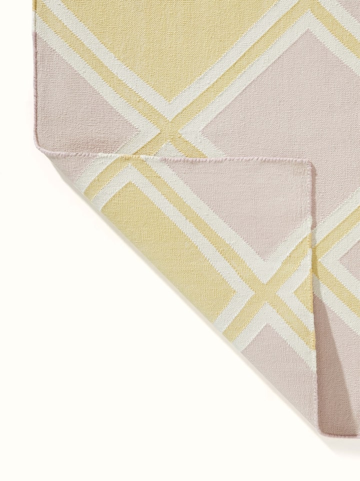 Modern geo light pink lawan cotton panja dhurrie featuring a full view of its stylish geometric pattern and soft texture.