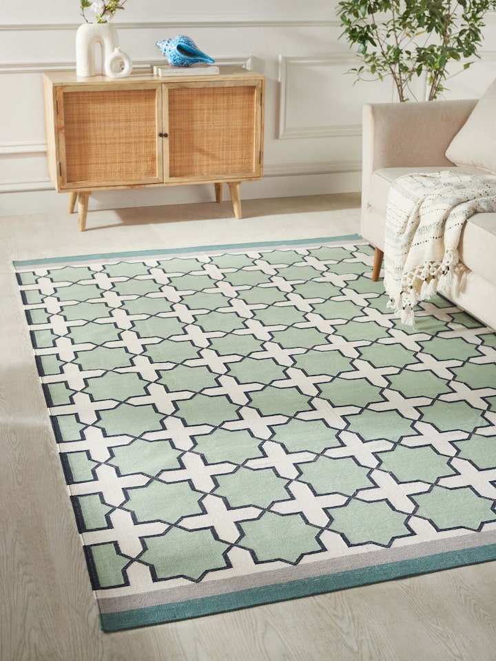 Close-up of Modern Geo Jharokha green grey Lawan cotton Panja dhurrie, highlighting the detailed geometric design and texture