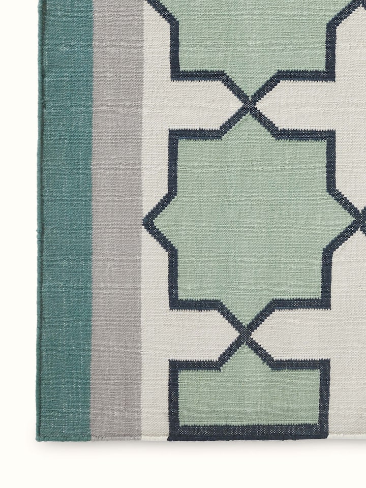 Detailed view of Modern Geo Jharokha green grey Lawan cotton Panja dhurrie, focusing on the intricate geometric pattern and fabric