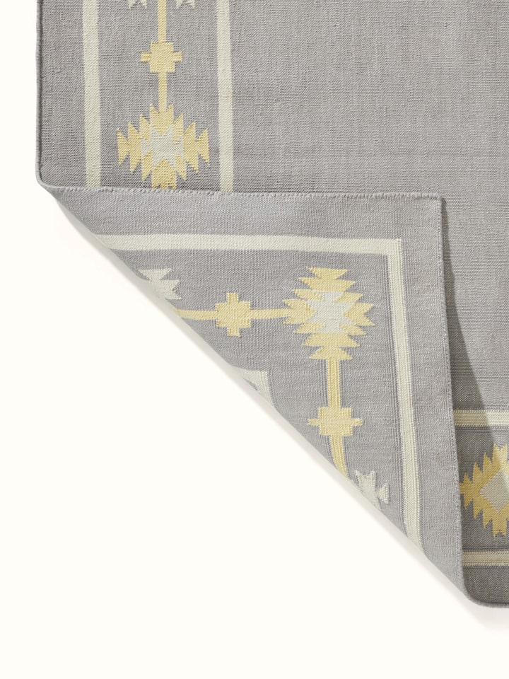 Close-up of Traditional Kilim grey yellow Lawan cotton Panja dhurrie, showing the weave and color details