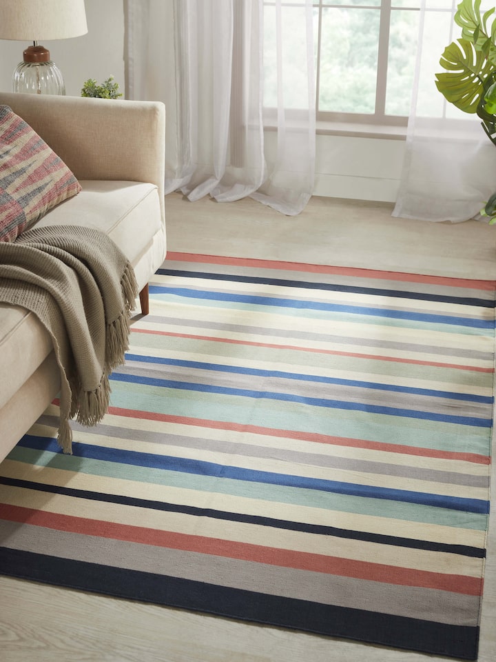 Close-up of Modern Geo Stripe Lawan Cotton Panja Dhurrie, focusing on the texture and intricate details of the stripes.