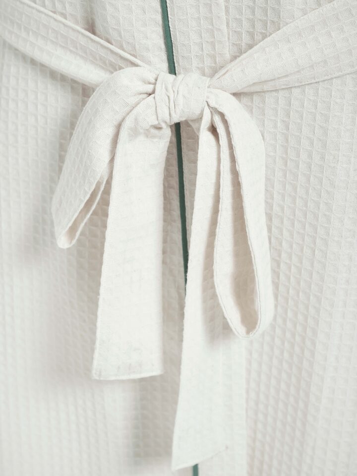 Full view of Multi Floral Cotton Sanganeri Block Printed Bathrobe draped on a hook, showcasing the overall design.