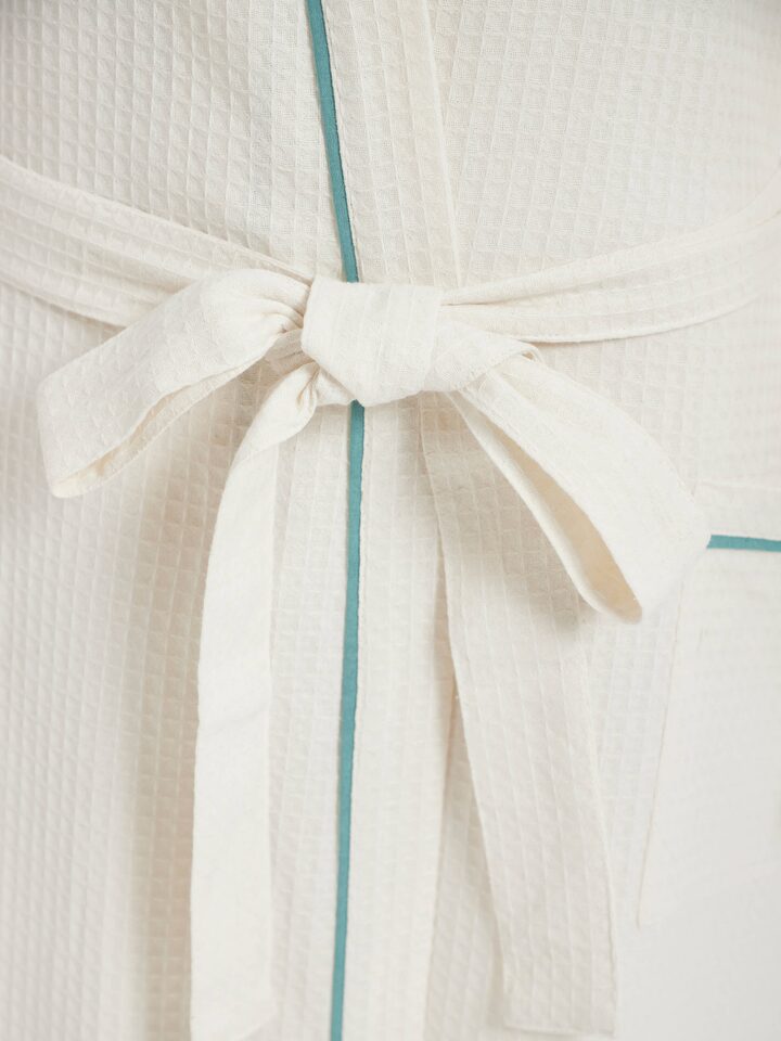 Angled view of Multi Floral Cotton Sanganeri Block Printed Bathrobe, focusing on the robe's fit and design.