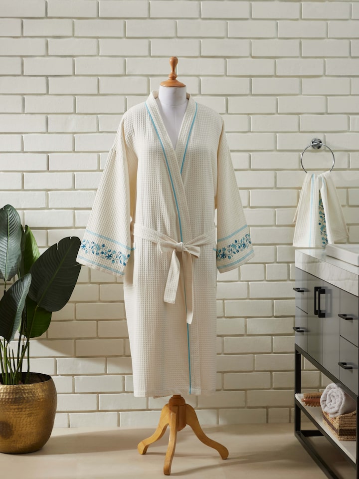 Close-up of Blue floral cotton Sanganeri block printed bathrobe focusing on the intricate block print and soft cotton fabric.