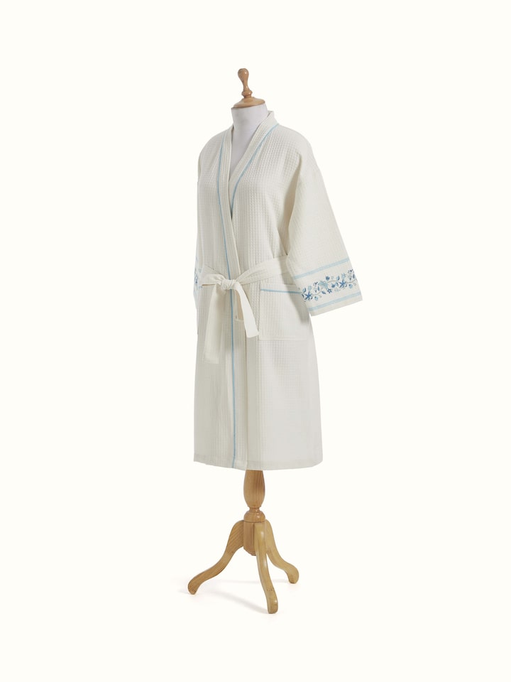 Angled view of Blue floral cotton Sanganeri block printed bathrobe displaying the overall pattern and comfortable fit.