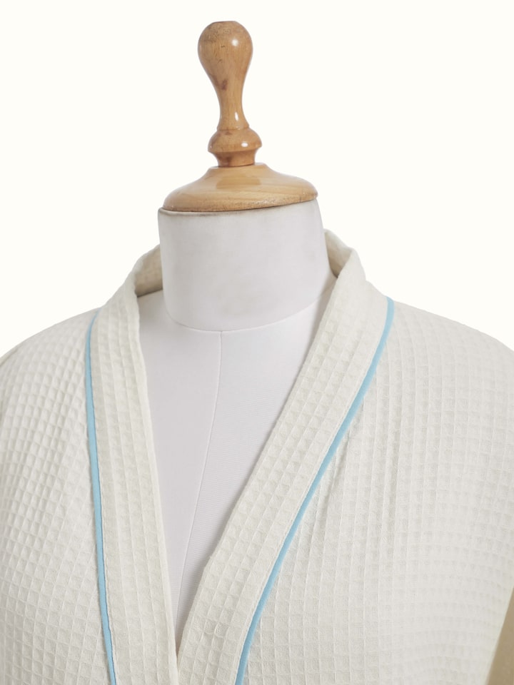 Close-up of Blue floral cotton Sanganeri block printed bathrobe focusing on the fine details of the floral block print.