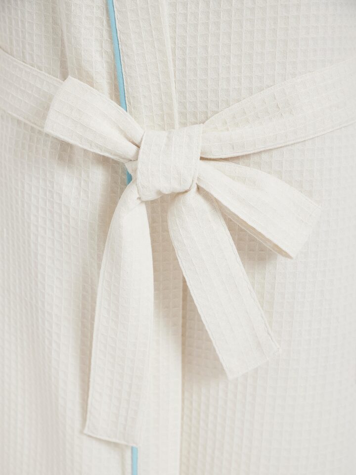 Detailed view of Blue floral cotton Sanganeri block printed bathrobe showing the softness of the fabric and clarity of the print.