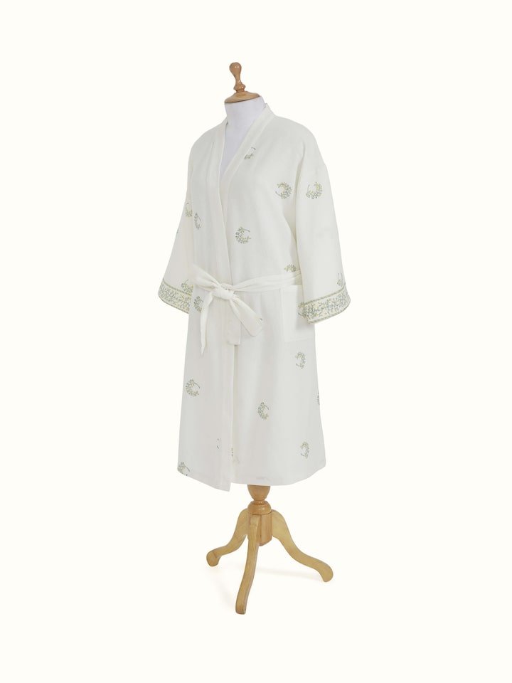 Close-up of the floral print on Ambi Buta yellow cotton Sanganeri block printed bathrobe