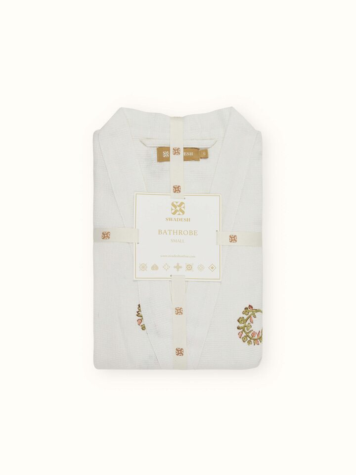 Detail view of Ambi Buta Peach Floral Cotton Sanganeri Block Printed Bathrobe highlighting the embroidery and stitch detail, from a different angle
