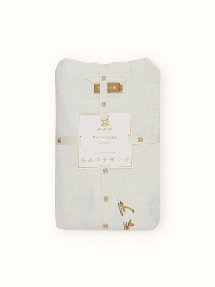 Detail view of Ambi Buta Peach Floral Cotton Sanganeri Block Printed Bathrobe highlighting the embroidery and stitch detail, from a different angle