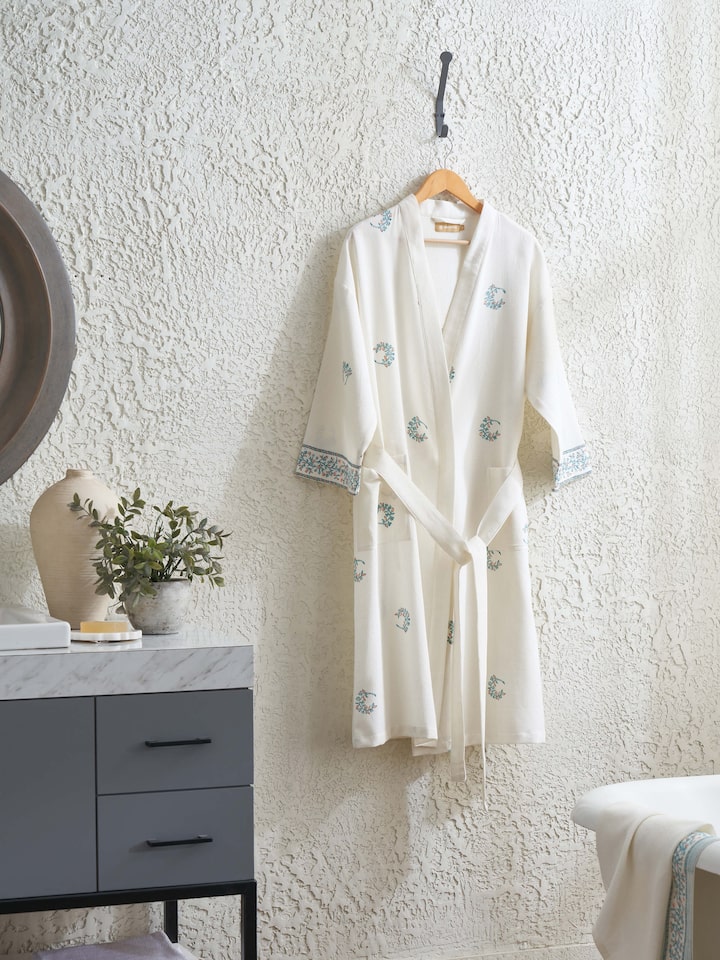 Close-up of the blue floral cotton Sanganeri block printed bathrobe focusing on the intricate floral design