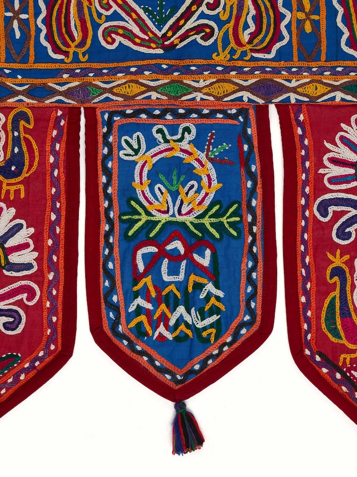 Close-up view of Kutch Embroidery Floral Toran by Swadesh, showcasing the craftsmanship and vibrant hues in the embroidery work.