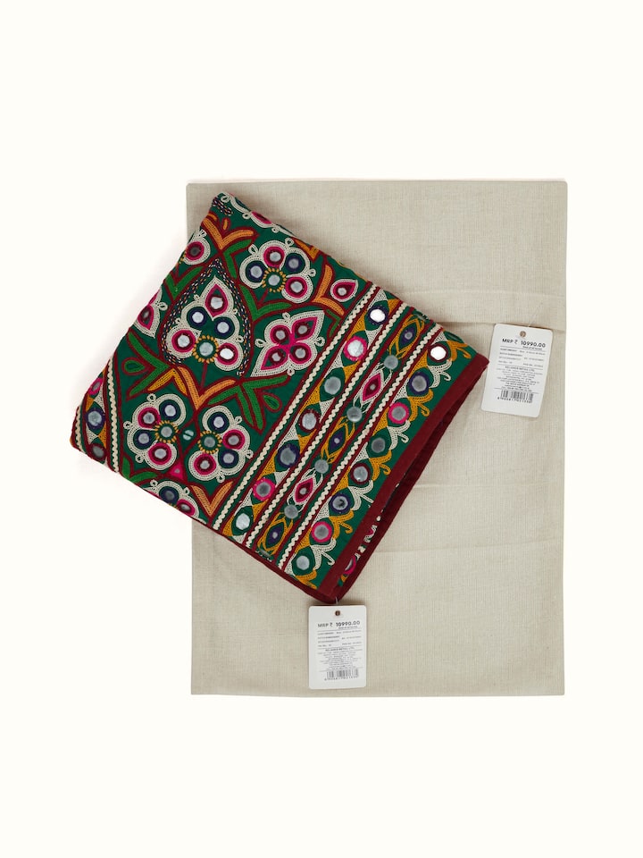 Angled view of Kutch Embroidery Geometric Toran highlighting the vibrant colors and detailed stitching of the traditional fabric