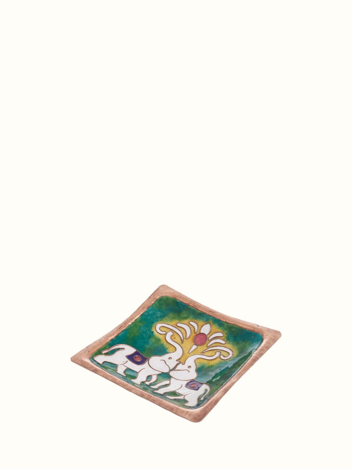 Detailed view of copper tray highlighting its elegant design and craftsmanship.