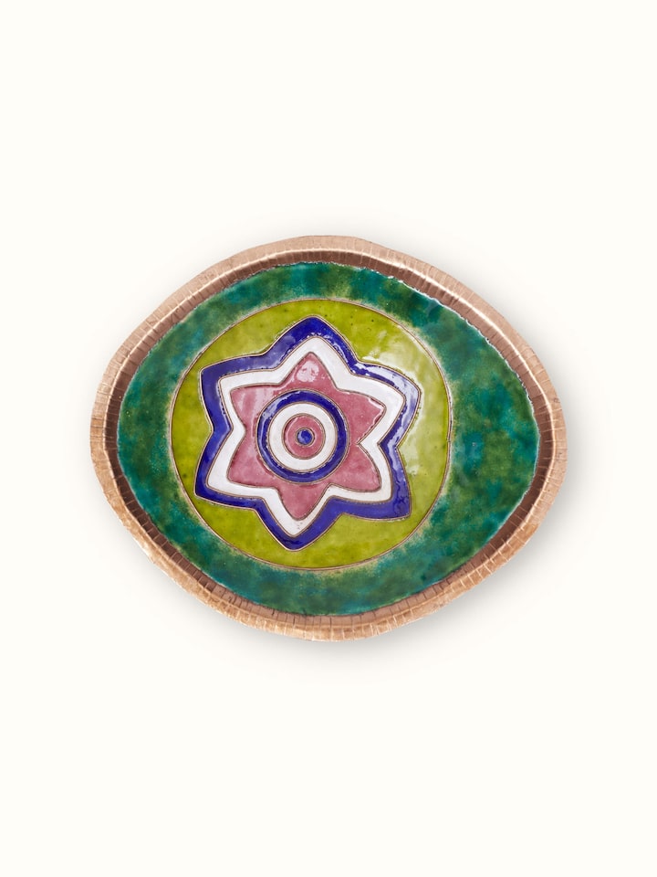 Detailed view of copper nut bowl showing intricate design