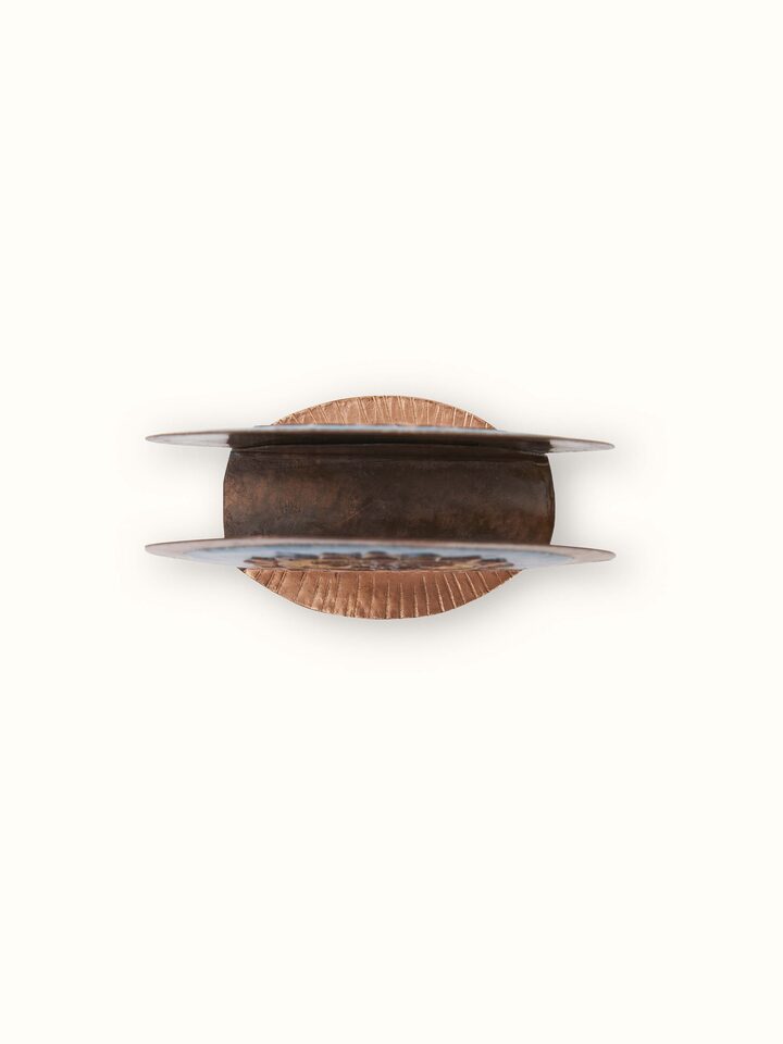 Side view of Copper sunshine round card holder blue, focusing on the polished finish and round shape.