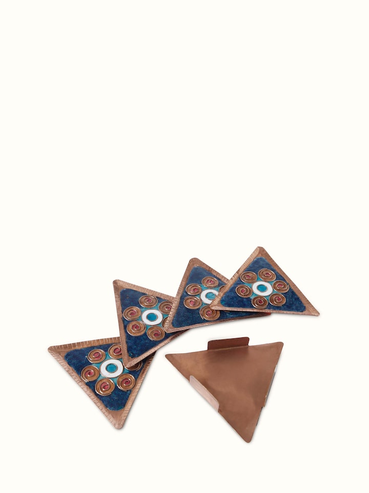 Detailed view of Triangular copper coaster showcasing its polished finish