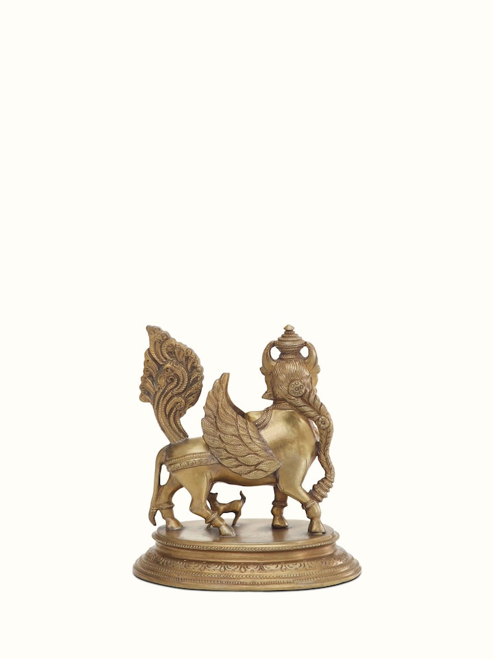 Close-up of Kamadhenu bronze casting idol showing intricate design