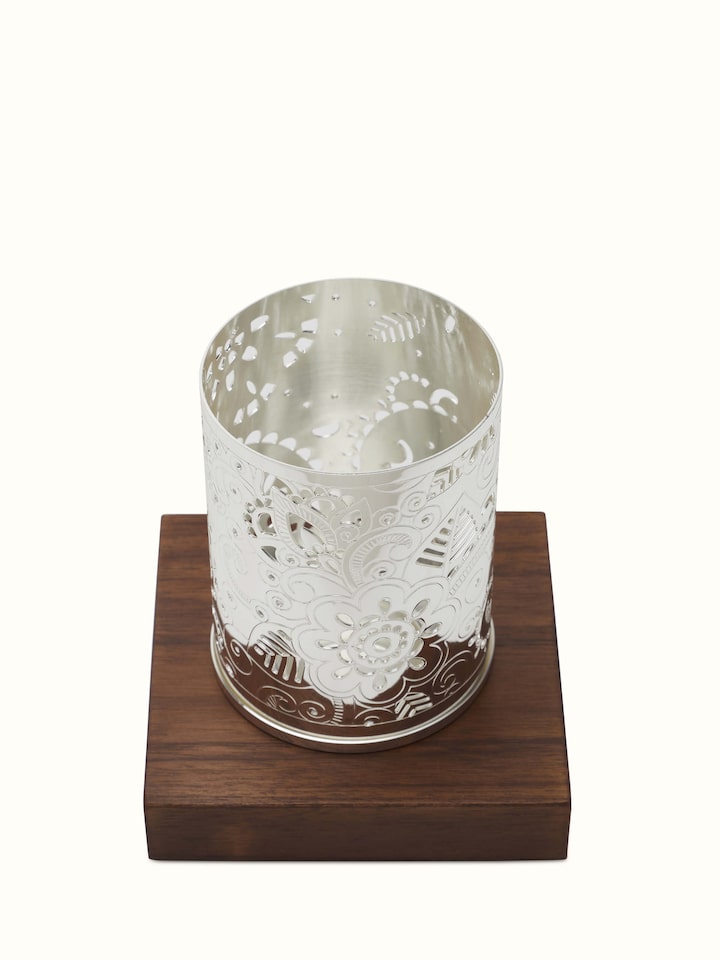 Side view of Silver-Plated Round Paisley Tea Light Holder highlighting design.