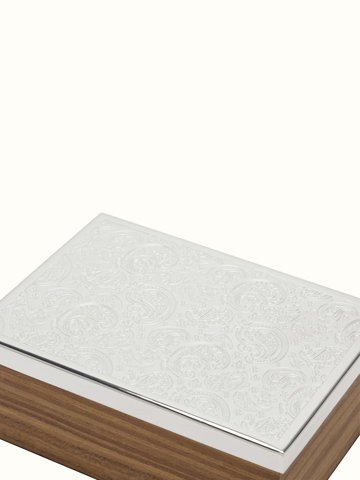 Side view of silver-plated paisley rectangular box with detailed engravings