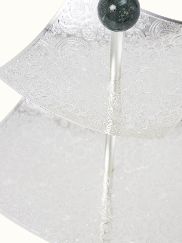 Close-up view of silver-plated paisley 2-tier square platter with detailed paisley design and finish