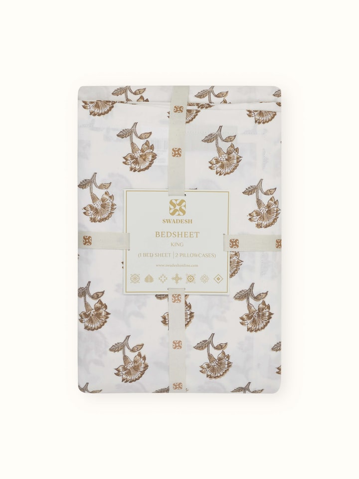 Image of Aarunya Beige Floral Cotton Sanganeri Block Printed King Bedsheet Set, showcasing the bedsheet and pillow covers in a room setting.