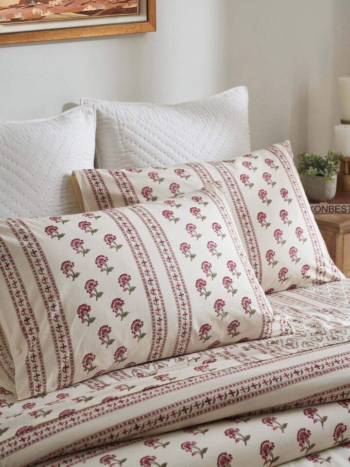 Close-up of Aarunya Red Stripe pillow cases highlighting the Sanganeri block print details