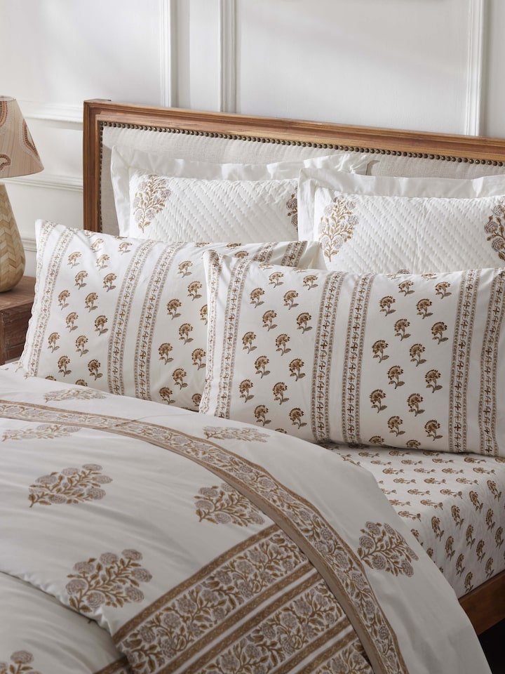 Close-up view of Aarunya beige buti cotton pillow cases showcasing intricate Sanganeri block print