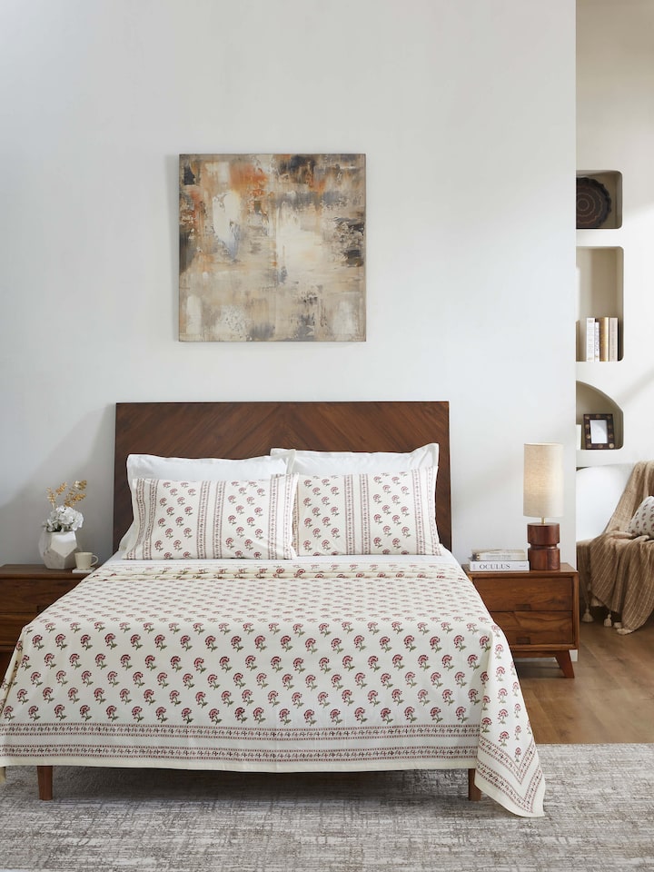 Detailed close-up of Aarunya red buti cotton Sanganeri block printed queen bedsheet set (3 pcs) highlighting the intricate block print design.