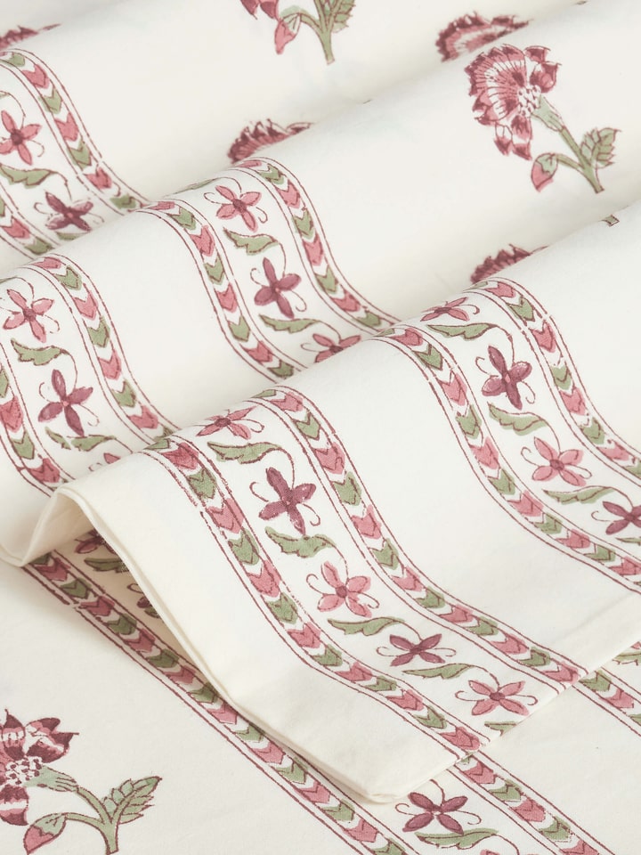 Perspective view of Aarunya red buti cotton Sanganeri block printed queen bedsheet set (3 pcs) displaying the overall design and texture.