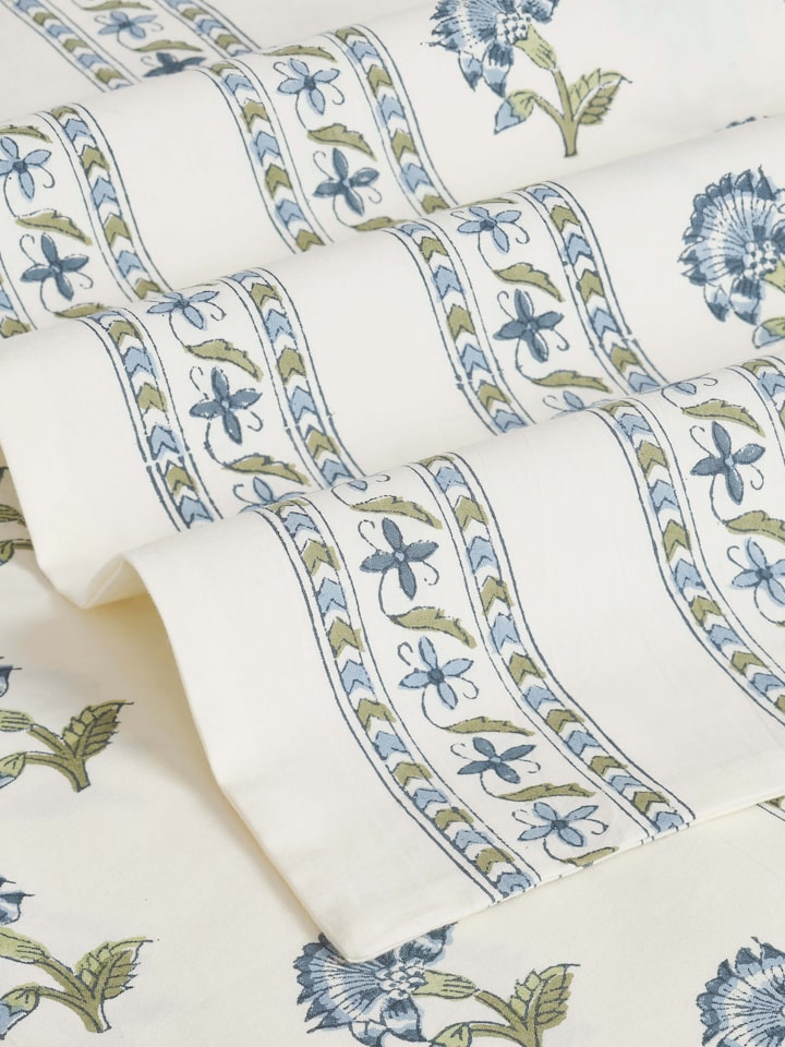 Close-up view of Aarunya Blue Buti Cotton Sanganeri Block Printed Queen Bedsheet Set (3 pcs) showcasing the detailed blue buti block print.