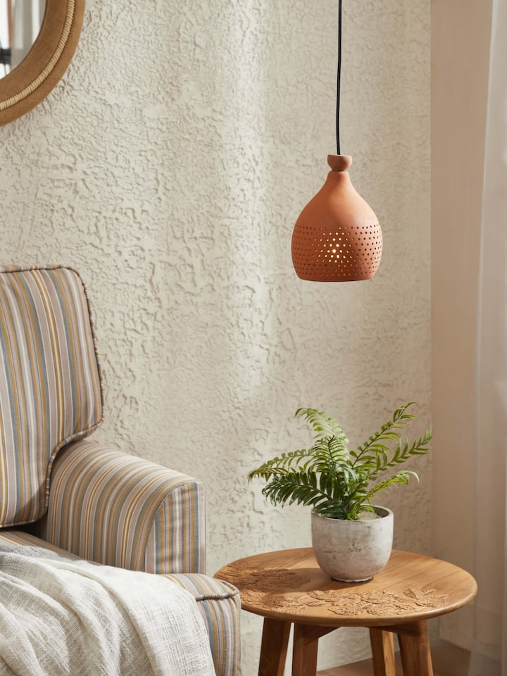 Side view of Natural Terracotta Pendant Lights (Small), showcasing the shape and hanging details