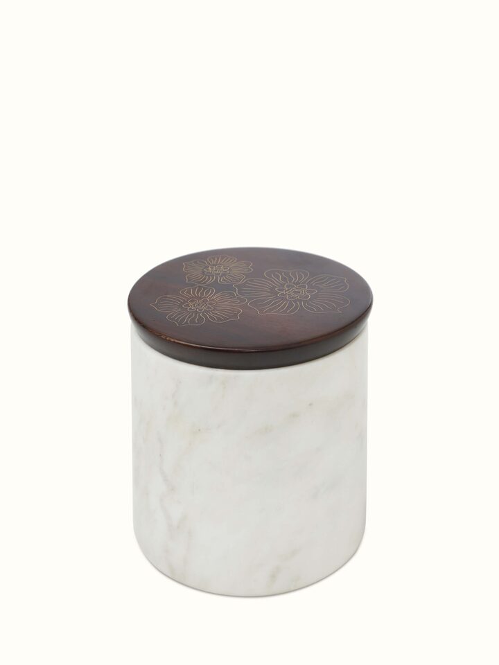 Close-up of Tarkashi sheesham wood and brass jars, showcasing the detailed craftsmanship and rich materials.