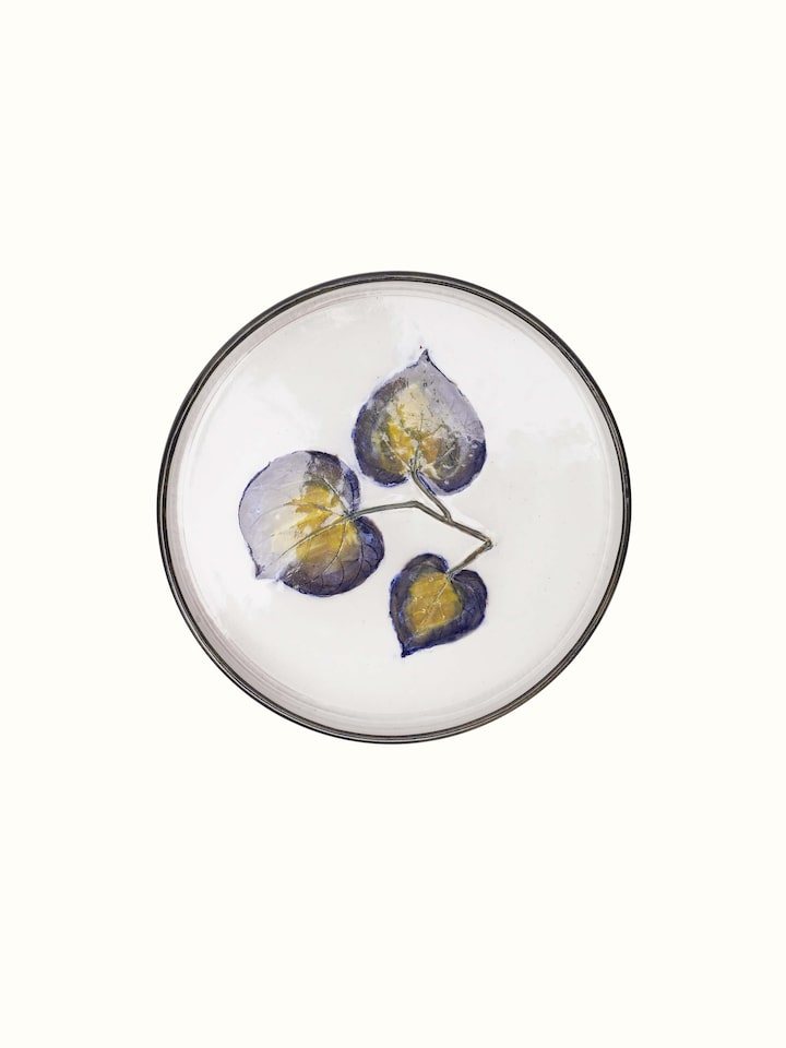 Angled view of Glazed studio pottery ceramic dinner plate emphasizing its elegant shape and finish