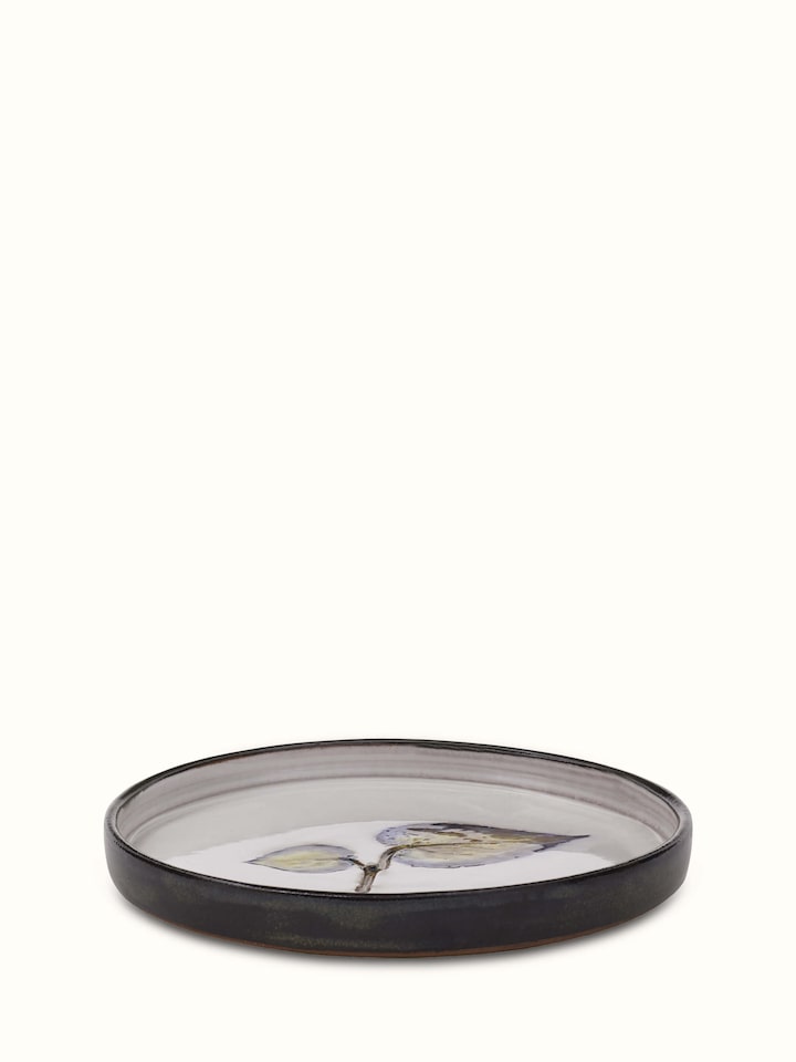 Overall view of studio pottery ceramic dessert plate showing its elegant design