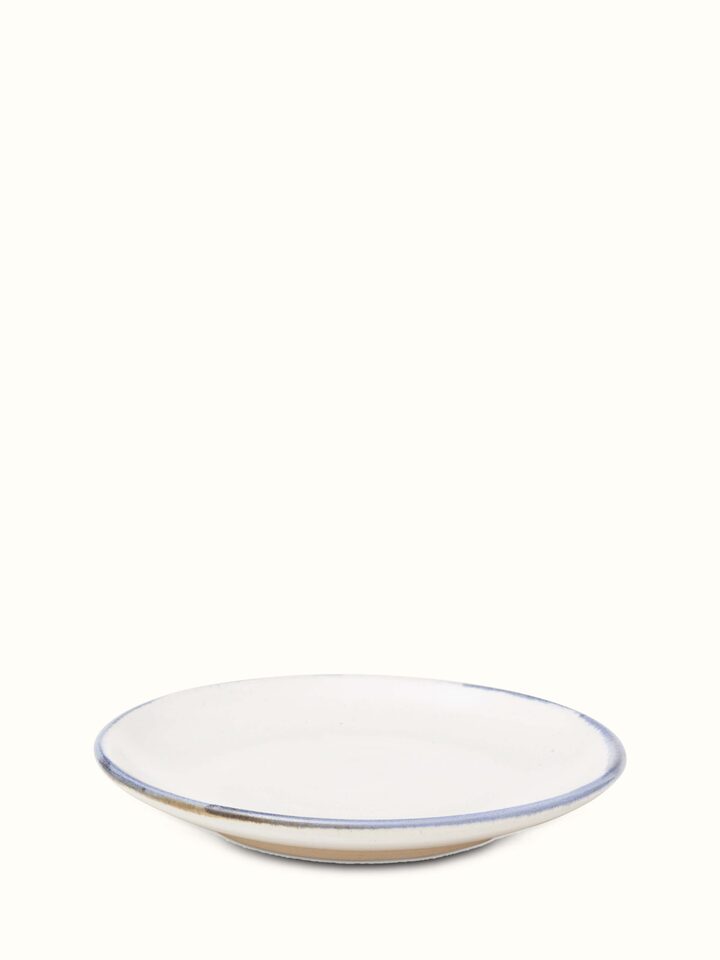 Side view of Studio pottery ceramic salad plate white