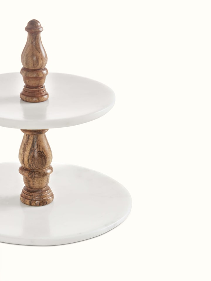 Angled view of Marble Inlaid Two-Tier Cake Stand