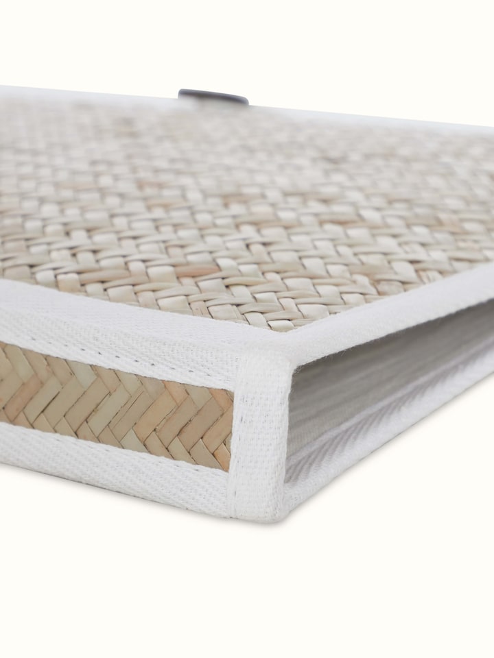 Detailed shot of bamboo sital patti file folder in brown showing close-up of the weave and texture.