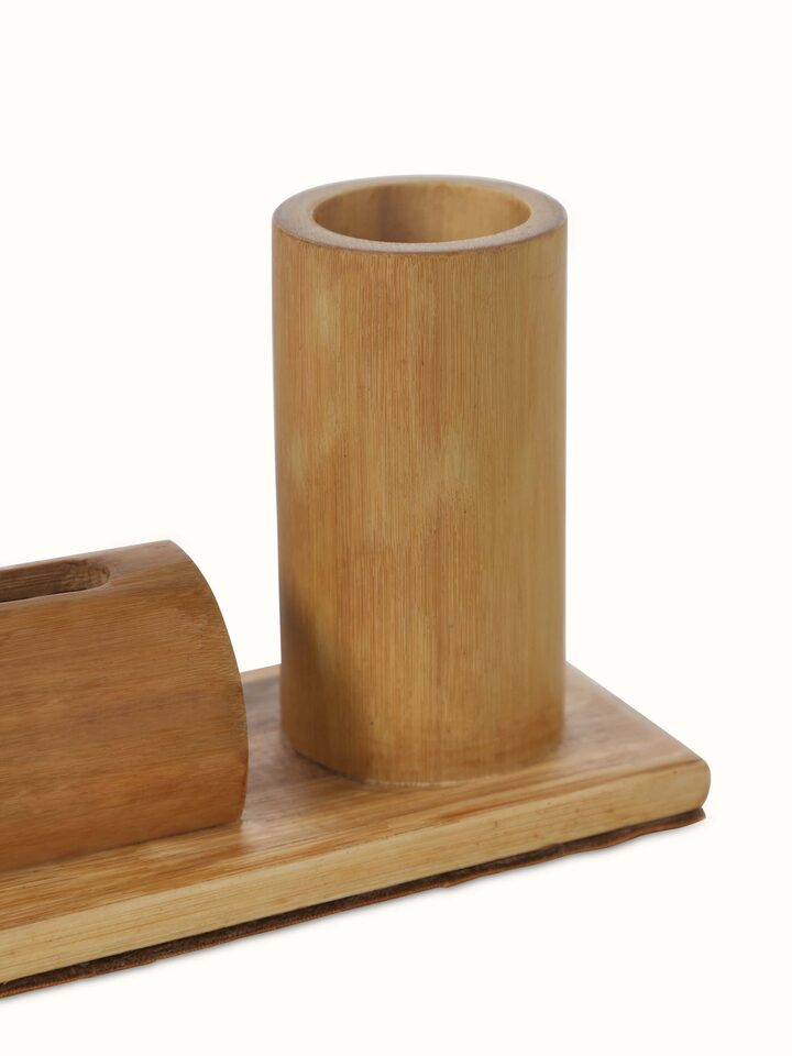 Close-up of bamboo buffet pen and card holder highlighting fine craftsmanship and texture